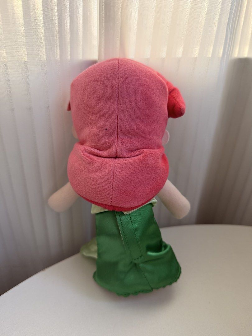 Disney NuiMos Ariel (Category: Plushies & Soft Toys) located in Baguio. Submitted by shamdcny (Listing ID 1468714375, Image 2). Description: *light discoloration of the hair Disney Little Mermaid Ariel plush toy. Red hair with pink flower accessory. Purple seashell top and shiny green tail skirt. Soft stuffed fabric material, embroidered facial features and eyes. Small dark spot on the back of the head. Clean otherwise. .