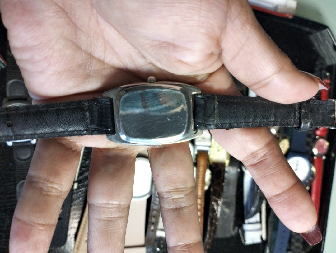 Disney Mickey Mouse Wristwatch with Black Leather Strap (Category: Women's Watches) located in General Mariano Alvarez. Submitted by ma.miafajardo1219 (Listing ID 1468925147, Image 2). Description: - Brand: Disney (Mickey Mouse) - Dial: White rectangular with classic black numbers - Case: Silver-toned with polished metal back (minor hairline scratches) - Strap: Textured black leather with traditional buckle closure - Style: Casual everyday timepi