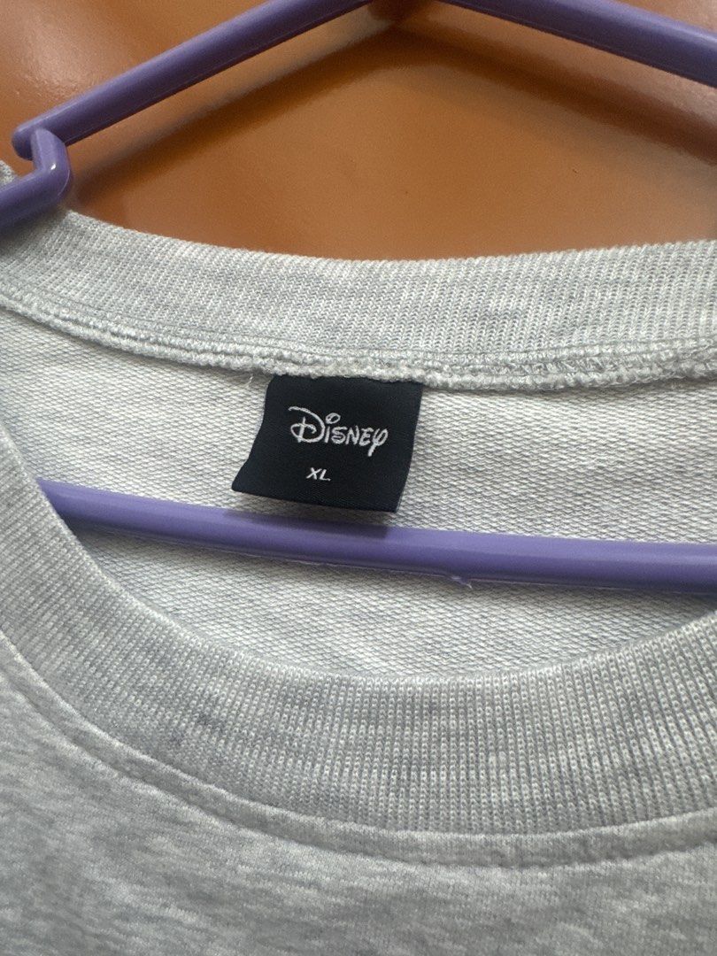 Disney Minnie Mouse Gray Sweatshirt Size XL (Category: Coats, Jackets and Outerwear) located in Santo Tomas. Submitted by toughu (Listing ID 1468746489, Image 2). Description: - Authentic Disney grey sweatshirt featuring Minnie Mouse - Stylish red, white, and yellow college stripes on front and sleeves - Size: XL - Material: Soft and warm cotton blend - Classic crew neck with ribbed cuffs and hem for a great fit - Condition: Excellent for daily c