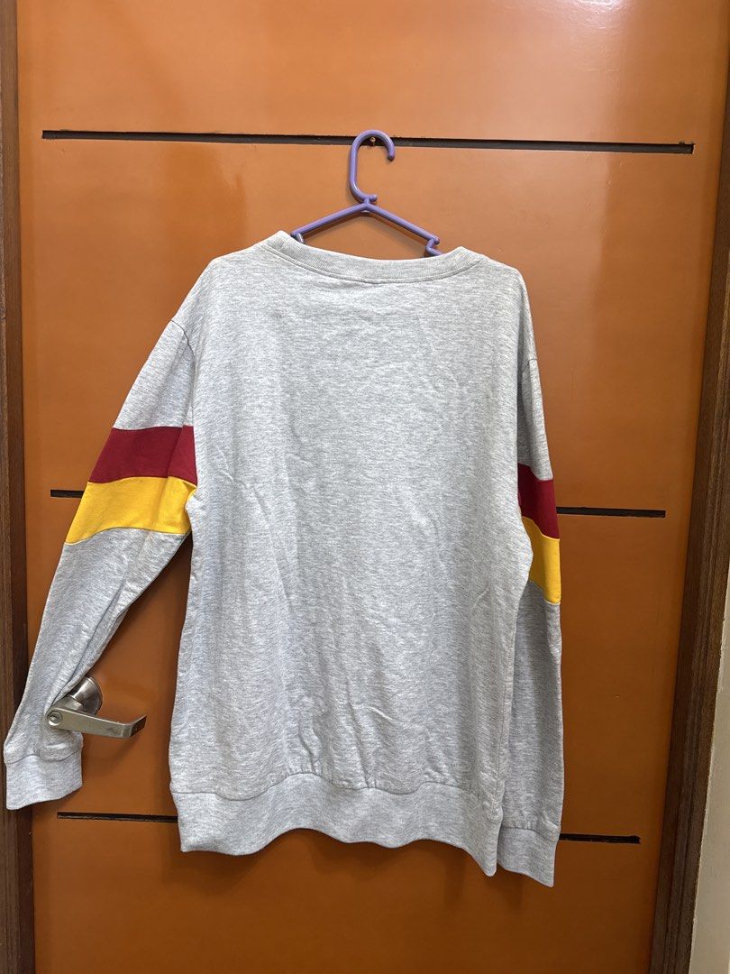 Disney Minnie Mouse Gray Sweatshirt Size XL (Category: Coats, Jackets and Outerwear) located in Santo Tomas. Submitted by toughu (Listing ID 1468746489, Image 3). Description: - Authentic Disney grey sweatshirt featuring Minnie Mouse - Stylish red, white, and yellow college stripes on front and sleeves - Size: XL - Material: Soft and warm cotton blend - Classic crew neck with ribbed cuffs and hem for a great fit - Condition: Excellent for daily c