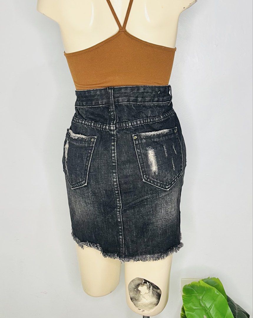 Black Denim Mini Skirt |Size 29-30 (Category: Skirts) located in Manila. Submitted by bengirlclothing (Listing ID 1468855641, Image 2). Description: - Style: Black denim mini skirt with heavy distressing and washed finish - Details: Raw frayed hem, front slits on both sides, button closure, and belt loops - Pockets: Functional back pockets with distressed detailing - Measurements: Waist 29-30, Length 16 - Condition: Great piece for effortless str