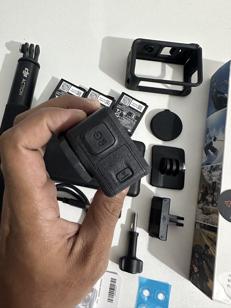 DJI Osmo Action 5 Pro Adventure Combo (Category: Cameras) located in Taytay. Submitted by jc.cruz03 (Listing ID 1468774856, Image 2). Description: - Brand: DJI Osmo Action 5 Pro Adventure Combo - Condition: Excellent, comes with original retail box - What's included: - Osmo Action 5 Pro camera & protective frame - 3x batteries with multi-battery charging case - Extension rod & locking screws - Quick-release adapter mounts & curved adhesive base -