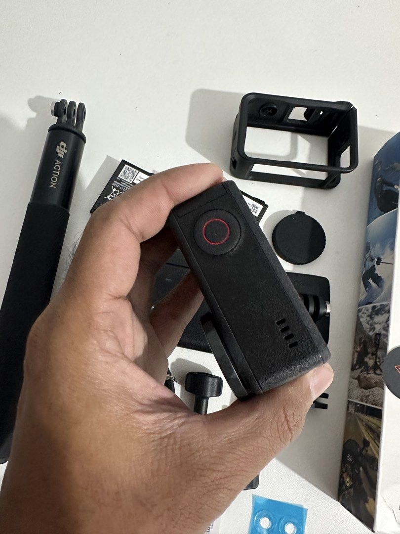 DJI Osmo Action 5 Pro Adventure Combo (Category: Cameras) located in Taytay. Submitted by jc.cruz03 (Listing ID 1468774856, Image 3). Description: - Brand: DJI Osmo Action 5 Pro Adventure Combo - Condition: Excellent, comes with original retail box - What's included: - Osmo Action 5 Pro camera & protective frame - 3x batteries with multi-battery charging case - Extension rod & locking screws - Quick-release adapter mounts & curved adhesive base -