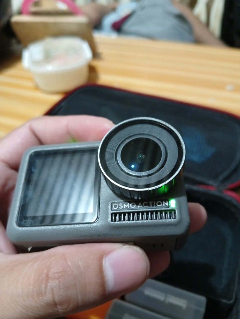 DJI Osmo Action Camera (Category: Cameras) located in Makati City. Submitted by yheenjiro123091 (Listing ID 1468797555, Image 1). Description: - Tested and 100% working DJI Osmo Action camera - Powers on successfully with green LED indicator active - Clear rear touchscreen displaying playback interface smoothly - Perfect compact device for travel, sports, and outdoor adventures - Includes protective carrying case and handy battery storage boxes -