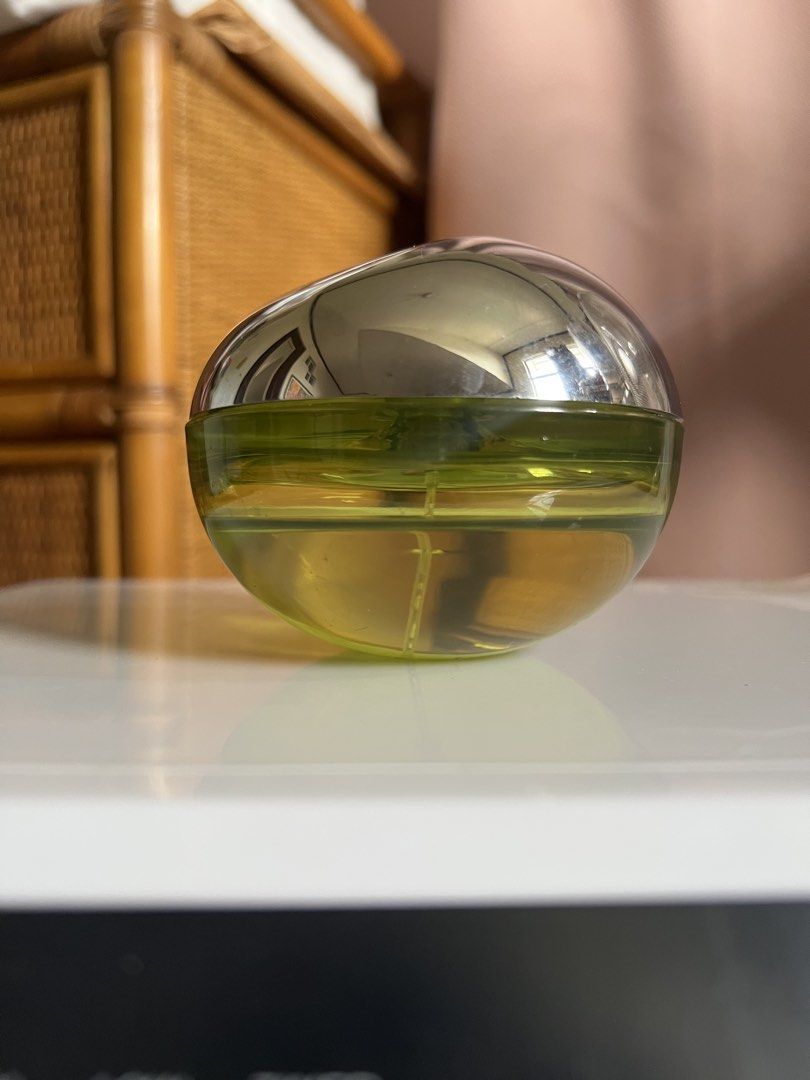 DKNY Be Delicious Eau de Parfum (Category: Fragrance & Deodorants) located in Rizal. Submitted by s0apandglory (Listing ID 1468769868, Image 1). Description: - Authentic DKNY Be Delicious perfume in iconic green apple bottle - Features silver metallic top cap with original yellow brand sticker intact - Green glass body clearly shows remaining fragrance level - Timeless, classic fresh scent perfect for daily wear - Well-maintained and ready for it
