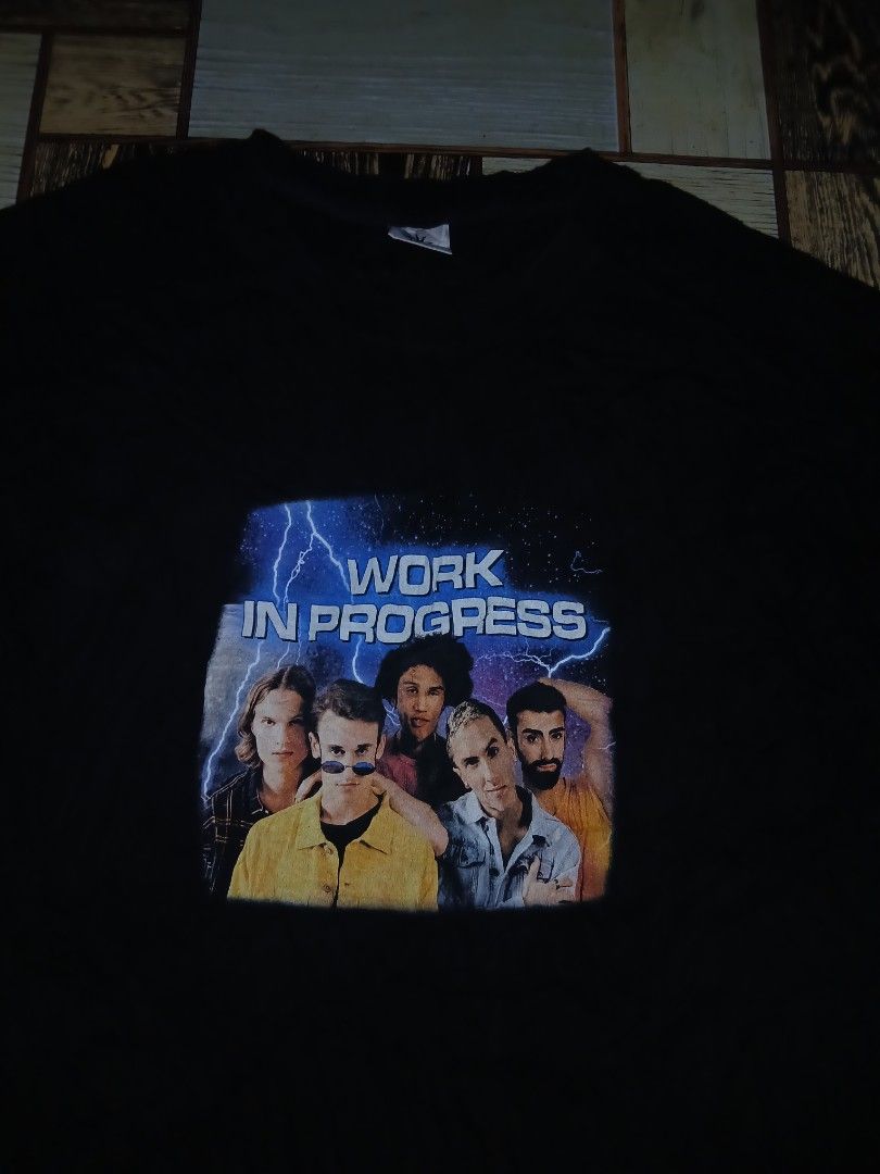 Dominant Work in Progress Graphic Black T-Shirt Size L (Category: Tshirts & Polo Shirts ) located in Caloocan City. Submitted by youngmoon_51e2c6 (Listing ID 1468792601, Image 2). Description: - Brand: Dominant - Color: Black - Size: Large - Pit to Pit: 23 inches - Material: Soft cotton - Origin: Made in Korea - Design: Front graphic print with 'Work in Progress' text, group photo, and lightning background - Condition: Excellent, graphic is clean