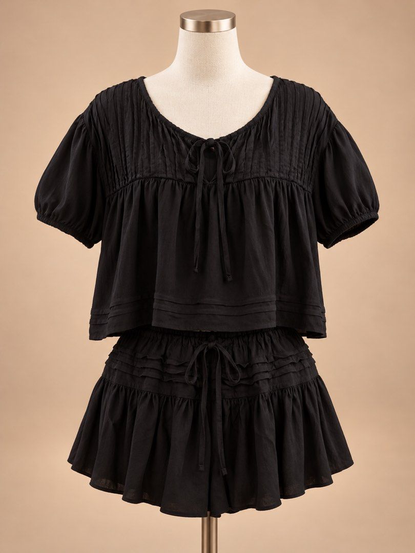 dominique & co. Coords (Category: Sets or Coordinates) located in Caloocan City. Submitted by joannarms320722 (Listing ID 1468780377, Image 1). Description: - Brand: Dominique & Co. - Color: Classic Black - Set includes: Short-sleeve crop top with tie neck/pleated details + matching ruffled skirt with drawstring waist - Material: Lightweight and breathable, perfect for the PH weather - Styling: Great as a matching set or styled separately - Condi