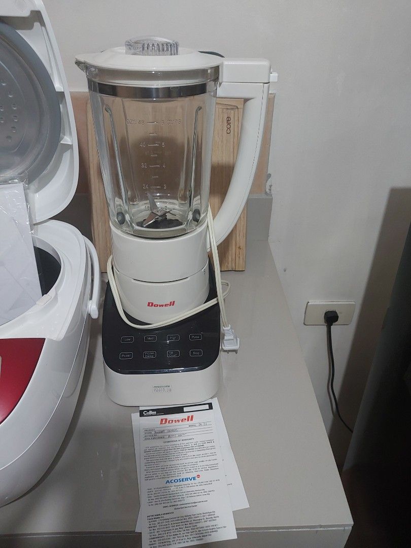 Dowell Blender with Warranty Card (Category: Juicers, Blenders & Grinders) located in Manila. Submitted by cheweyboy_ph (Listing ID 1468792135, Image 1). Description: - Brand: Dowell Food Blender - Color: Stylish black and white body - Pitcher: Large clear glass pitcher with easy-to-read measurement markings and a built-in handle - Performance: Sturdy internal blades with multiple speed and function buttons for versatile blending - Design: Power 