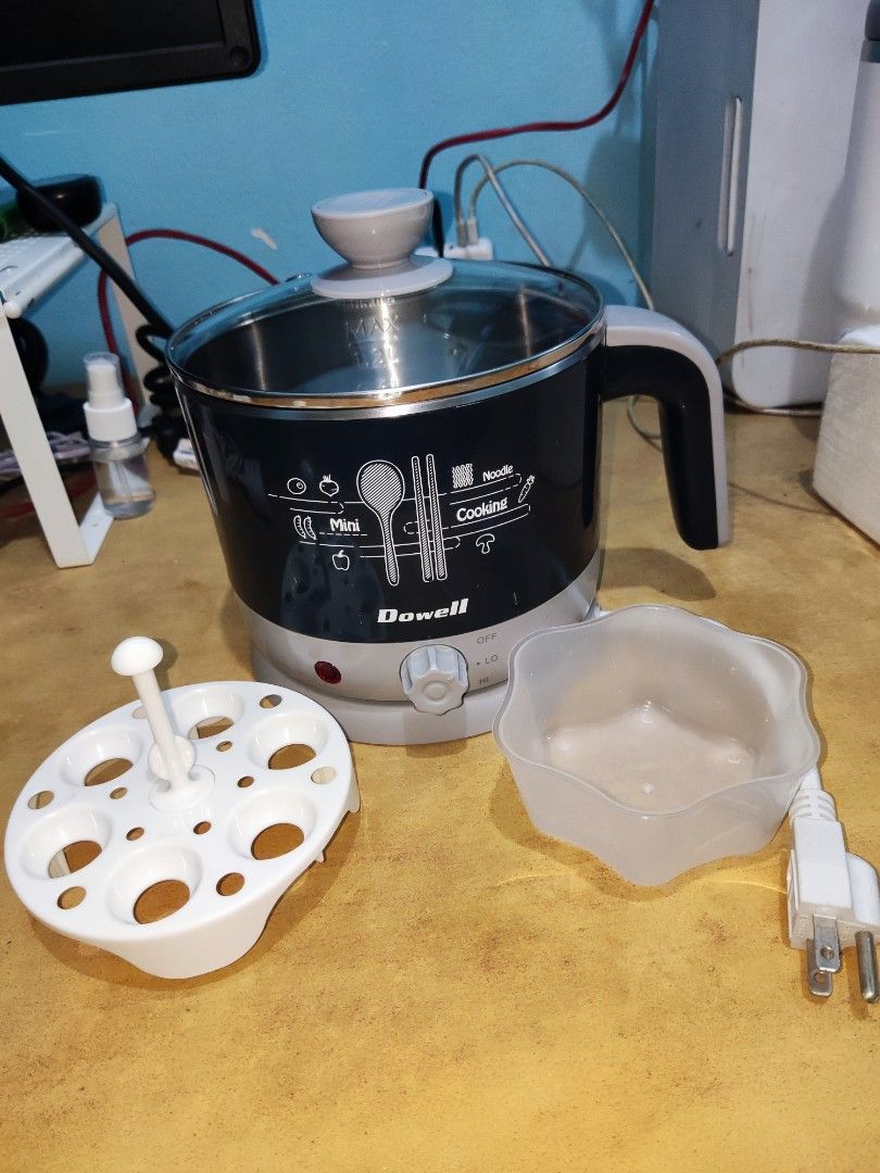 DOWELL Multi-purpose Cooker (1.2L) (Category: Cookers) located in Manila. Submitted by haggle.ph (Listing ID 1468918084, Image 1). Description: Dowell Electric Multi-purpose Cooker (1.2L) - No box - 100% Working, good condition - Egg holder included RFS: Decluttering Loc: Sampaloc Manila MOP: GCash/Maya (Payment first before shipping) Shipping: Buyer will shoulder shipping fee.