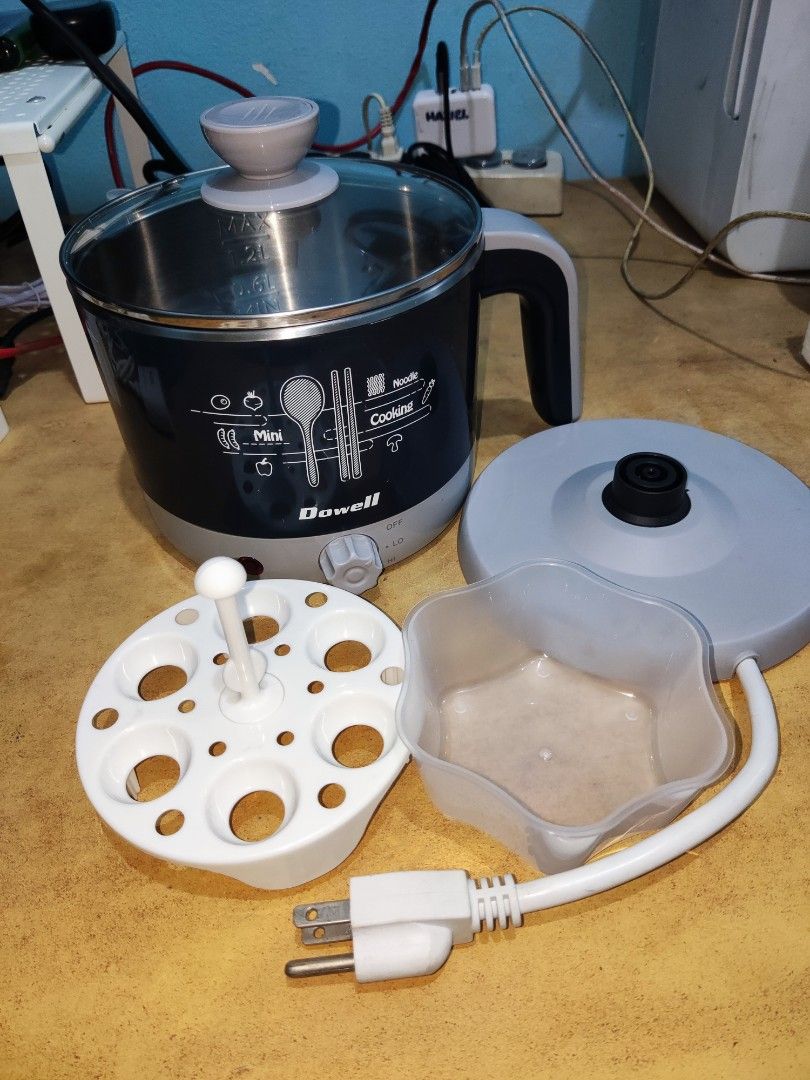 DOWELL Multi-purpose Cooker (1.2L) (Category: Cookers) located in Manila. Submitted by haggle.ph (Listing ID 1468918084, Image 2). Description: Dowell Electric Multi-purpose Cooker (1.2L) - No box - 100% Working, good condition - Egg holder included RFS: Decluttering Loc: Sampaloc Manila MOP: GCash/Maya (Payment first before shipping) Shipping: Buyer will shoulder shipping fee.