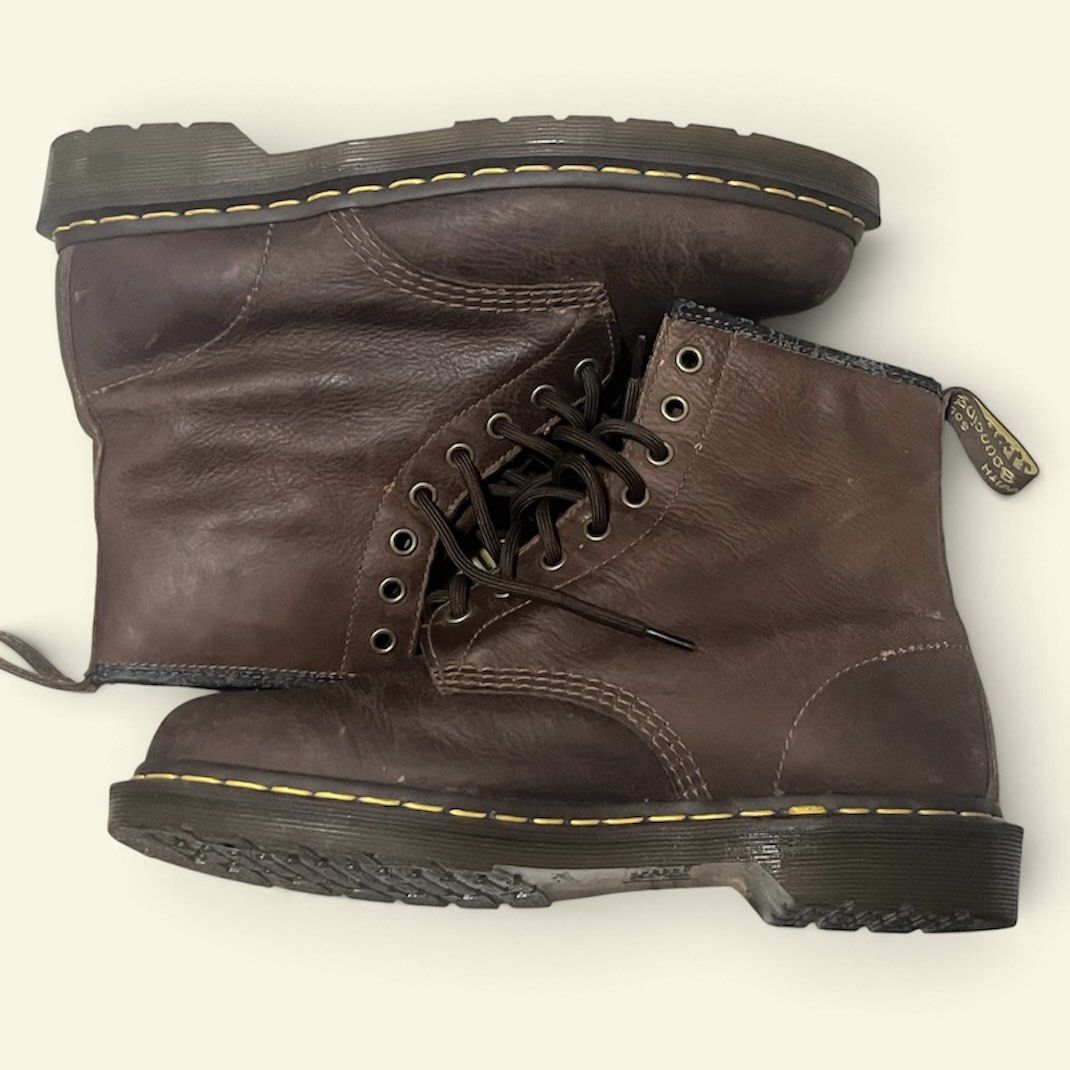 Dr. Martens 1460 Brown Leather Boots With Box (Category: Boots) located in Manila. Submitted by chococoffeeboy (Listing ID 1468888537, Image 2). Description: Dr. Martens 1460 - Tan/Dark Brown - Material: Leather - Classic 8-eyelet lace-up, iconic yellow welt stitching, bouncing soles tag - Condition: Lightly worn with minor creasing and scuffs; soles have plenty of life left -Replaced insoles - Inclusion: Original box with serial number Payment: 