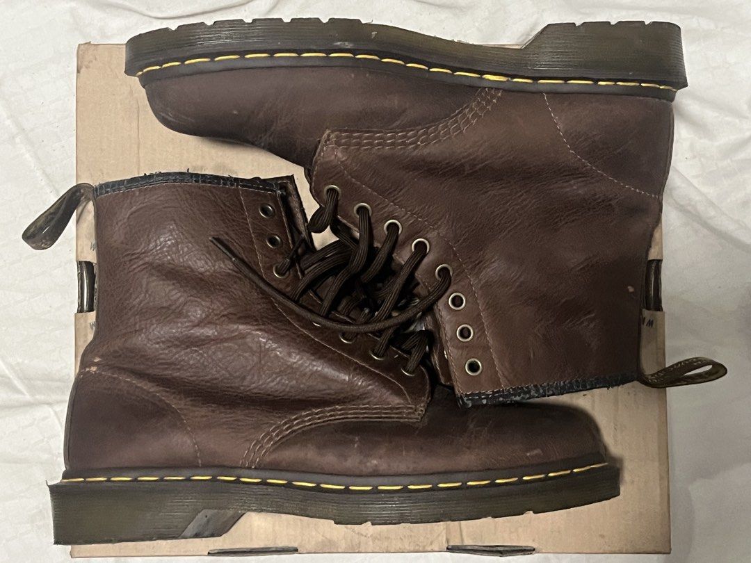 Dr. Martens 1460 Brown Leather Boots With Box (Category: Boots) located in Manila. Submitted by chococoffeeboy (Listing ID 1468888537, Image 1). Description: Dr. Martens 1460 - Tan/Dark Brown - Material: Leather - Classic 8-eyelet lace-up, iconic yellow welt stitching, bouncing soles tag - Condition: Lightly worn with minor creasing and scuffs; soles have plenty of life left -Replaced insoles - Inclusion: Original box with serial number Payment: 