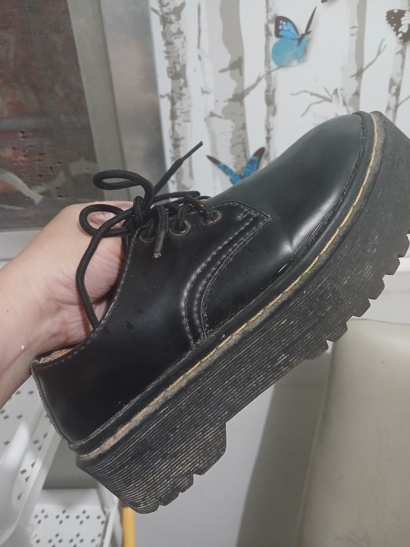 Dr. Martens Black Platform Derby Shoes (Category: Loafers) located in Quezon City. Submitted by bright.lenlen (Listing ID 1468836268, Image 1). Description: - Brand: Dr. Martens - Style: Black platform shoes with lace-up front and chunky lug sole - Details: Classic yellow welt stitching, leather upper, interior branding - Condition: Uppers are clean, soles show minor wear and dirt from previous use - Fit & Height: Solid platform height for an edg