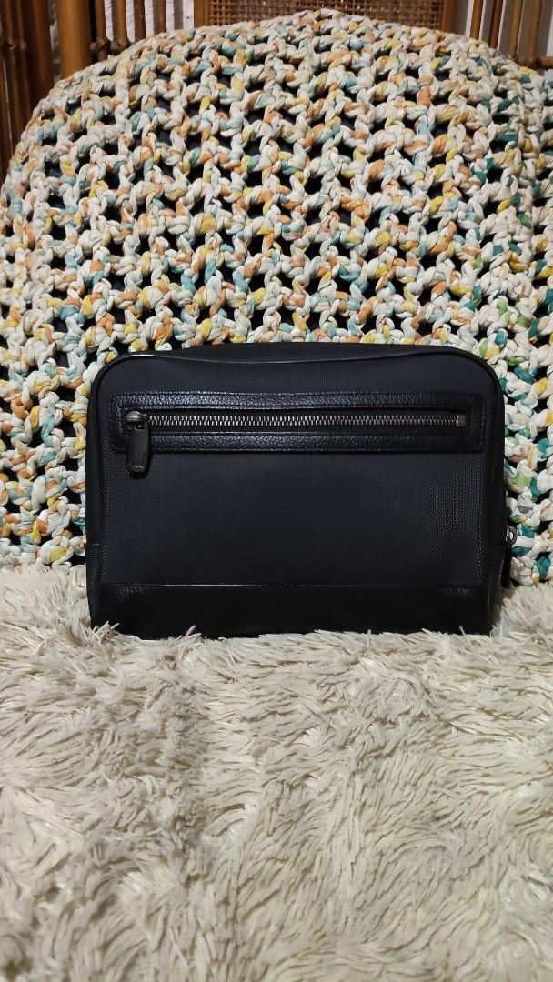 Dunhill (Category: Belt bags, Clutches and Pouches) located in Cebu City. Submitted by lumaynojes00490 (Listing ID 1468802017, Image 3). Description: - Color: Classic black - Material: Textured fabric with leather trim on the bottom and front pocket - Closure: Secure main zip-top closure plus an extra front zip compartment.
