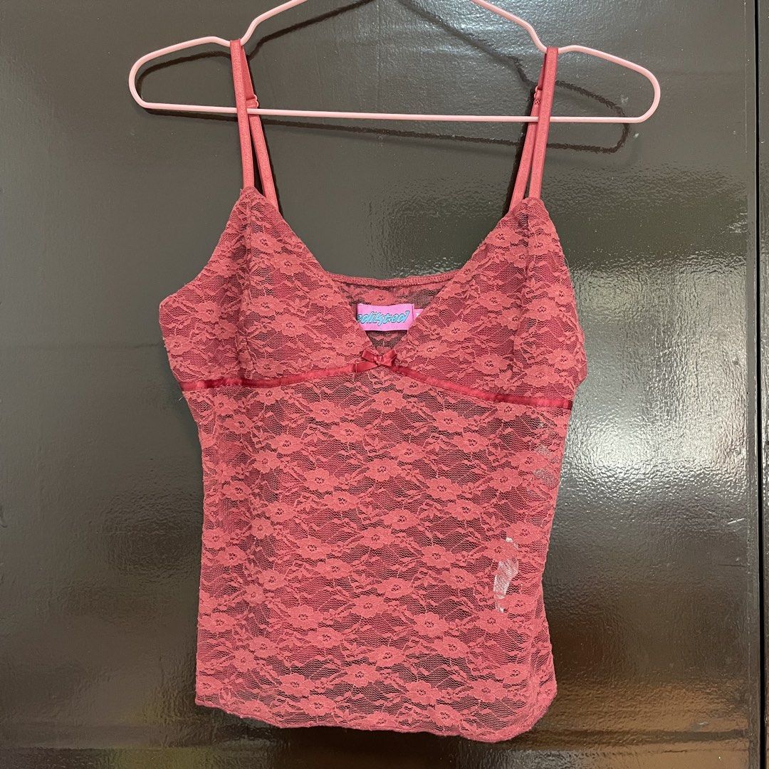 Edikted Pink Lace Cami Top Size M (Category: Sleeveless) located in Pasay City. Submitted by lovedbyzea (Listing ID 1468783956, Image 1). Description: - Brand: Edikted - Size: M - Color: Pink - Material: Soft and stretchy sheer floral lace - Features: Adjustable spaghetti straps and center front bow - Styling: Great for layering over a tee or wearing solo.