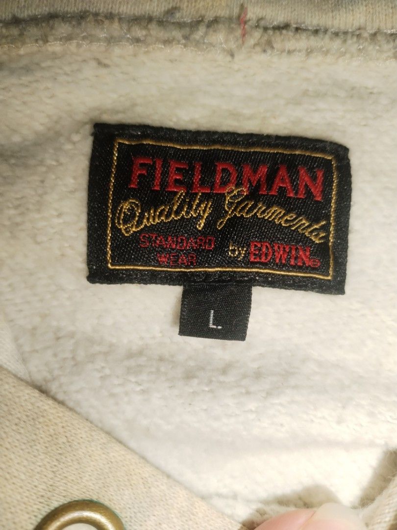 EDWIN FIELDMAN HOODIE (Category: Coats, Jackets and Outerwear) located in Baguio. Submitted by luxeloomarchive (Listing ID 1468857177, Image 3). Description: FIELDMAN BY EDWIN ​Vintage U.S. Lansing Graphic Pullover Hoodie ​A classic vintage hoodie in an oatmeal/light gray color tone, featuring a bold "U.S. LANSING FOSTER CITY.95" front graphic. Includes a kangaroo pocket, brass hood grommets, and a 100% premium cotton body. ​DETAILS ​Brand: Field