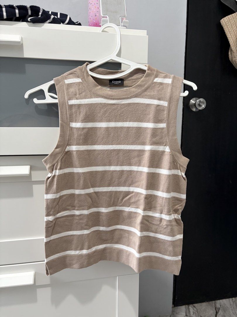 EMME Striped Knit Tank Top (Category: Sleeveless) located in Bulacan. Submitted by lenggayy (Listing ID 1468800673, Image 1). Description: - Brand: EMME - Design: Classic beige & white horizontal stripes - Cut: Crew neckline, sleeveless - Details: Ribbed trim on collar, armholes, & hem - Material: Soft knit fabric - Style: Versatile basic piece, great for layering or warm days.