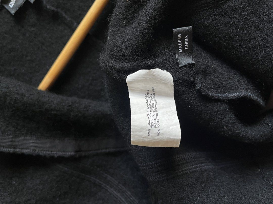 Emporio Armani Black Wool Jacket Size 46 (Category: Coats, Jackets and Outerwear) located in Bulacan. Submitted by handmedownfinds (Listing ID 1468718000, Image 3). Description: - Brand: Emporio Armani - Color: Black - Size: 46 (label inside collar) - Material: 100% Wool (shell), 100% Polyester (lining 2) - Design: Buttonless open front, structured paneling, ribbed detailing, and front flap pockets - Origin: Made in China - Condition: Excellent p