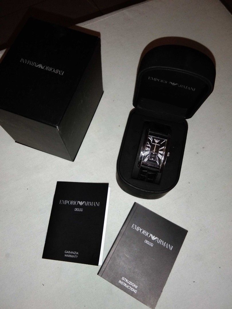 Emporio Armani Rectangular Black Dial Leather Watch (Category: Men's Watches) located in Taguig. Submitted by frenchquarter_010107 (Listing ID 1468925465, Image 3). Description: - Brand: Emporio Armani - Case: Silver-tone rectangular design - Dial: Classic black with Roman numerals and small seconds sub-dial - Strap: Genuine black leather with an embossed pattern - Inclusions: Original box, warranty booklet, and instruction manual - Condition: we