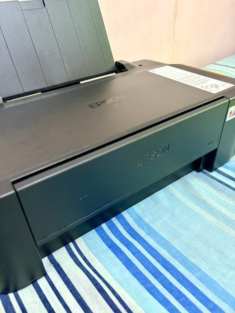 Epson L121 Printer with Paper bundles (Category: Printers, Scanners & Copiers) located in Lipa City. Submitted by heyimdg (Listing ID 1468717004, Image 3). Description: PRINTER SET with ~1.1k worth of materials & ink Inclusions: Epson Ecotank L121 (w/ full ink) Power cable CD Driver, Setup Guide & Utilities Remaining ink bottles A4 Photo Paper 115gsm A4 Photo Paper 230gsm RC Woven 5R Photo Paper Glossy Photo Sticker A4 Inkjet Matte Paper 108gsm V
