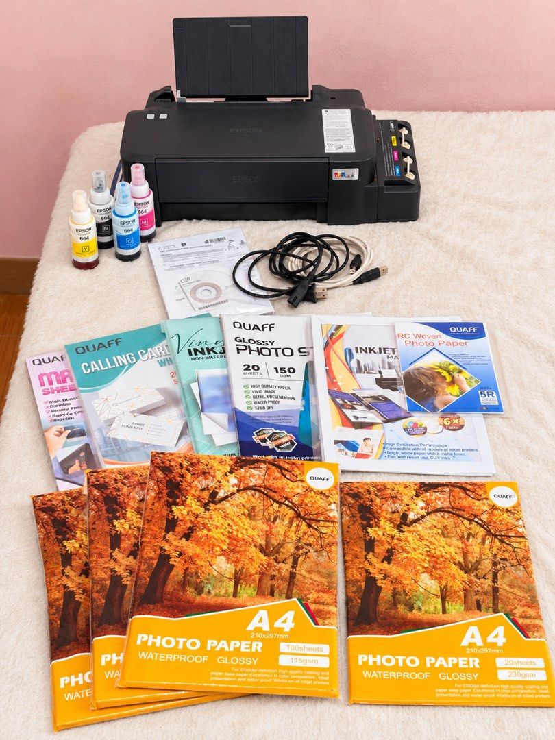 Epson L121 Printer with Paper bundles (Category: Printers, Scanners & Copiers) located in Lipa City. Submitted by heyimdg (Listing ID 1468717004, Image 1). Description: PRINTER SET with ~1.1k worth of materials & ink Inclusions: Epson Ecotank L121 (w/ full ink) Power cable CD Driver, Setup Guide & Utilities Remaining ink bottles A4 Photo Paper 115gsm A4 Photo Paper 230gsm RC Woven 5R Photo Paper Glossy Photo Sticker A4 Inkjet Matte Paper 108gsm V