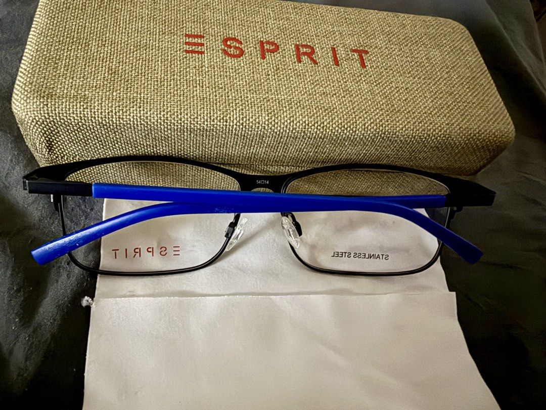 Esprit Stainless Steel Eyeglasses Frames with Case (Category: Sunglasses & Eyewear) located in Marikina City. Submitted by maekristine.abadam (Listing ID 1468811642, Image 2). Description: - Brand: Esprit - Material: Durable stainless steel - Color: Black front with bright blue temple arms - Size: 54-14-140 - Lenses: Original demo lenses - Inclusion: Textured beige Esprit hard case - Condition: Excellent, ready for your graded lenses.