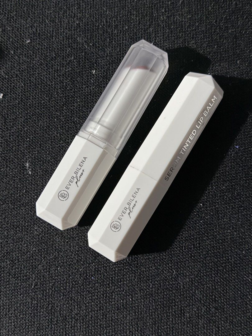 Ever Bilena Plus Serum Tinted Lip Balm Set (Category: Makeup) located in Malabon City. Submitted by annshopable_ (Listing ID 1468858870, Image 2). Description: - Brand: Ever Bilena Plus - Product: Serum Tinted Lip Balm Bundle - Shades: Spiced & Toast of New York - Size: 3.2g per stick - Condition: Barely used, twist-up mechanism works smoothly - Packaging: White hexagonal tubes with clear caps - Ideal for: Everyday wear and effortless looks Take 