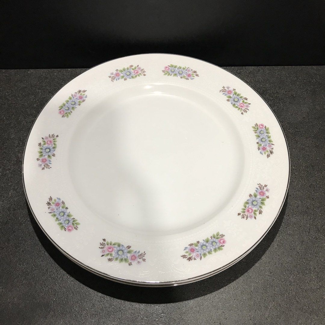 Everbrite Rosanne Fine China Dinner Plates Set (Category: Dinnerware & Cutlery) located in Baao. Submitted by all.things.japan (Listing ID 1468744774, Image 2). Description: 10.25 x 0.75 inches -Brand/Origin: Everbrite Rosanne, Made in Japan - Material: Fine white porcelain - Design: Pink and blue floral clusters with embossed details and silver trim - Condition: Excellent, clean bottoms with original maker stamps intact - Perfect for: Dining col