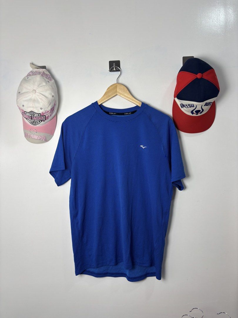Everlast Blue Athletic T-Shirt (Category: Activewear) located in Calbayog City. Submitted by zaxcheus_castillo1708 (Listing ID 1468753721, Image 1). Description: - Brand: Everlast - Color: Bright blue - Fabric: Breathable, mesh-like texture - Design: Short sleeves, crew neck, small chest logo - Condition: Clean stitching, ready to wear - Ideal for: Workouts, gym sessions, and casual runs.