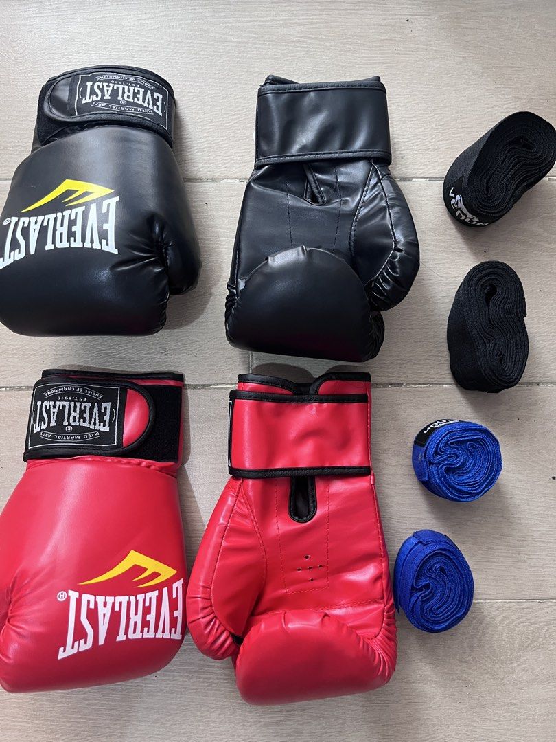 2 Pairs Boxing Gloves and Hand Wraps Bundle (Category: Combat Sports) located in Taguig. Submitted by graceeeee. (Listing ID 1468733331, Image 1). Description: - 2-person boxing/kickboxing starter kit - No issues. Used once. Cleaned. - 10oz gloves (1 black pair) and 12oz gloves (1 red pair) - Hand wraps included (2 black pairs, 2 blue pairs) - Bought from Laz 900+ Php RFS: moving out Loc: next to Venice Mall, Taguig.
