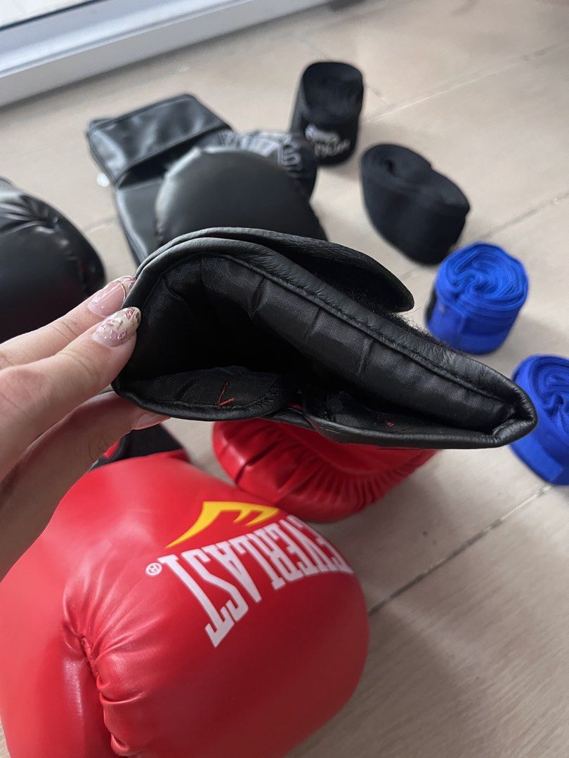 2 Pairs Boxing Gloves and Hand Wraps Bundle (Category: Combat Sports) located in Taguig. Submitted by graceeeee. (Listing ID 1468733331, Image 3). Description: - 2-person boxing/kickboxing starter kit - No issues. Used once. Cleaned. - 10oz gloves (1 black pair) and 12oz gloves (1 red pair) - Hand wraps included (2 black pairs, 2 blue pairs) - Bought from Laz 900+ Php RFS: moving out Loc: next to Venice Mall, Taguig.