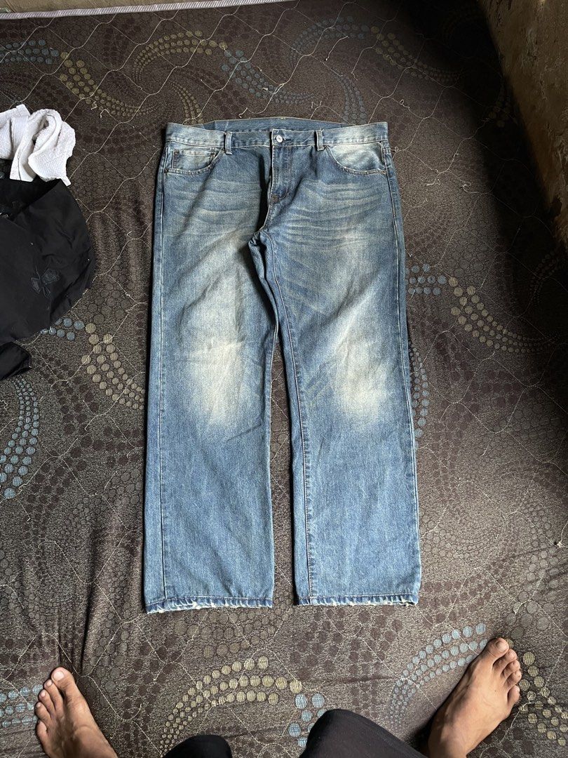 Evisu Denim Jeans Colorful Paisley Patchwork Back Y2K (Category: Jeans) located in Manila. Submitted by chawmichael (Listing ID 1468880593, Image 2). Description: - Style: Straight fit light wash denim jeans - Detailing: Embroidered gull logos on back pockets with yellow V-shaped yoke - Patches: Vibrant teal paisley patch on left leg, red paisley patch on right leg - Closure: Button fly - Finish: Fading on knees and thighs for a worn-in look - Co
