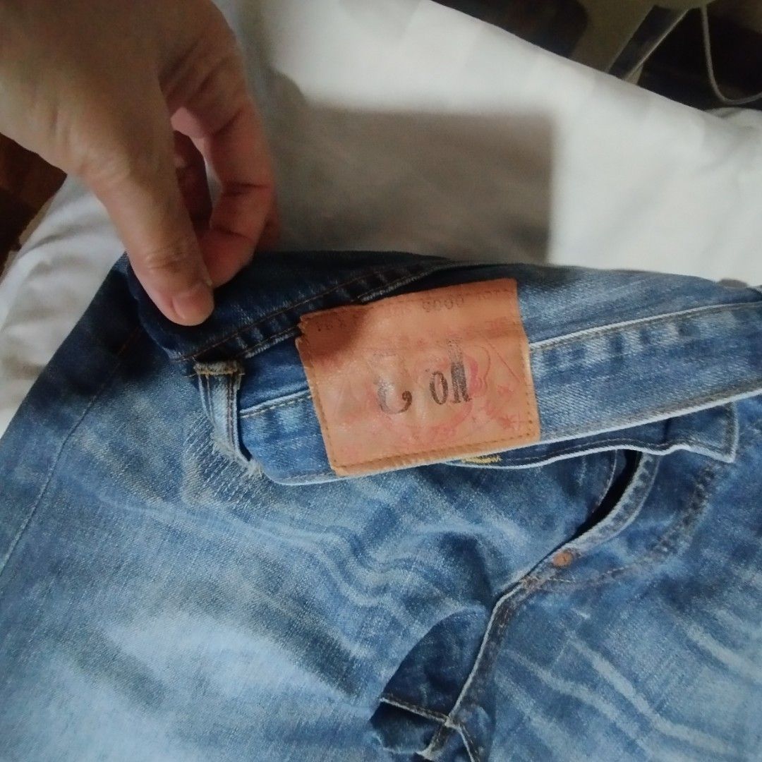 Evisu Distressed Denim Jeans Blue (Category: Jeans) located in Manila. Submitted by lene48 (Listing ID 1468726682, Image 1). Description: - Brand: Evisu - Color: Blue - Style: Distressed denim with slight rips and whiskering - Closure: Button fly - Details: Leather back patch, branded pocket lining, and unique handwritten blue text on the inside waistband lining - Condition: Excellent pre-loved condition - Location: Ships from PH / Meetups possib