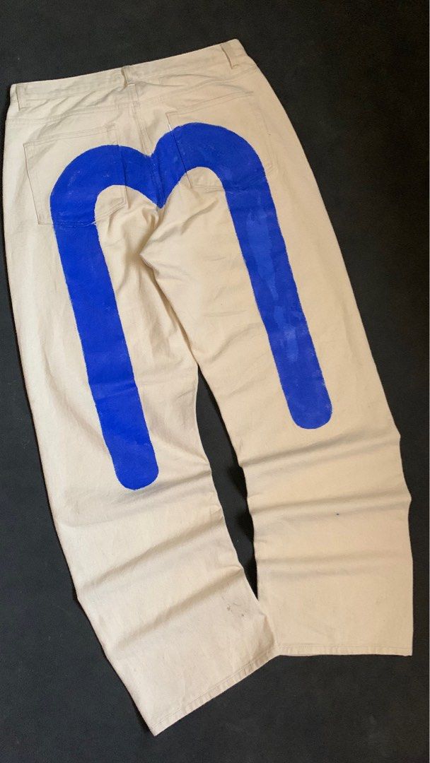 Evisu Off-White Denim Pants with Blue Seagull Back Print (Category: Jeans) located in Valencia. Submitted by davehandpicked (Listing ID 1468829062, Image 2). Description: - Brand: Evisu - Color: Off-white with contrast stitching - Material: Premium cotton denim / canvas-like fabric - Fit: Straight leg, regular fit - Design: Iconic large painted blue seagull logo on back pockets - Details: Classic waist with belt loops, standard rear pockets - Sty