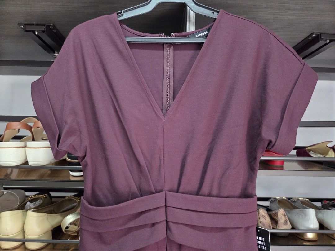 Express Burgundy Jumpsuit Size S (Category: Jumpsuits) located in San Juan City. Submitted by wisedolphin_5a645c (Listing ID 1468718540, Image 2). Description: - Brand: Express - Color: Rich burgundy - Size: S - Condition: Brand new with original tag attached - Material/Origin: Made in Sri Lanka - Design details: Short cuffed sleeves, V-neckline, back zipper closure, and pleated waist detailing - Style: Clean lines, classic color, and easy one-pi