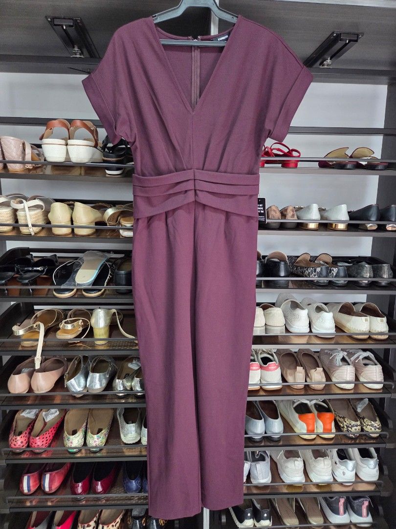 Express Burgundy Jumpsuit Size S (Category: Jumpsuits) located in San Juan City. Submitted by wisedolphin_5a645c (Listing ID 1468718540, Image 1). Description: - Brand: Express - Color: Rich burgundy - Size: S - Condition: Brand new with original tag attached - Material/Origin: Made in Sri Lanka - Design details: Short cuffed sleeves, V-neckline, back zipper closure, and pleated waist detailing - Style: Clean lines, classic color, and easy one-pi