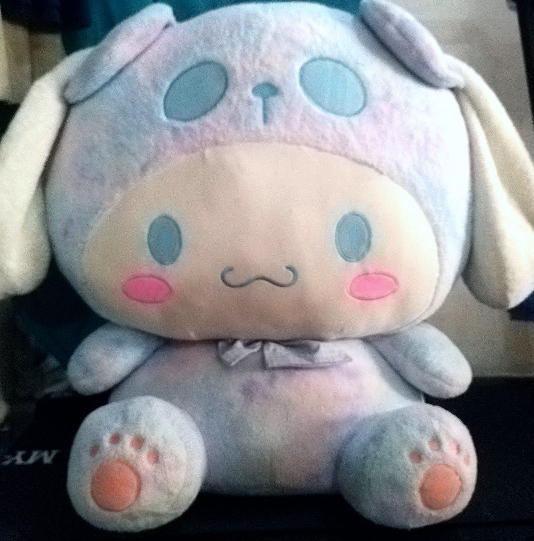 Extra Large Cinnamoroll Sanrio Plush Doll (Category: Plushies & Soft Toys) located in Los Banos. Submitted by marsnes (Listing ID 1468776108, Image 1). Description: - Sanrio Cinnamoroll plush doll - Size: Around 22 inches tall - Design: Pastel tie-dye panda hood with pink paw pads - Features: Super soft fur, bright blue eyes, and pink cheeks - Condition: Clean fabric, great for hugging and display.