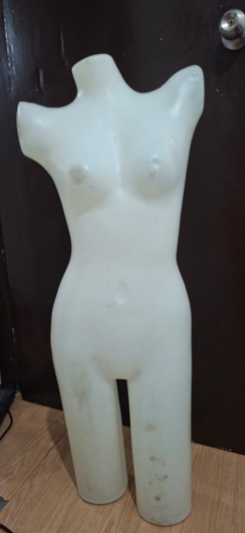 Female Torso Mannequin Display Form (Category: Blouses) located in Manila. Submitted by princessahshop (Listing ID 1468844711, Image 1). Description: - White plastic female torso mannequin with partial legs - Hollow back design making it lightweight and easy to hang or move - Perfect for displaying tops, dresses, and bottoms - Sturdy material that stands or lays flat easily - Note: Shows minor smudges and scuffs from storage.