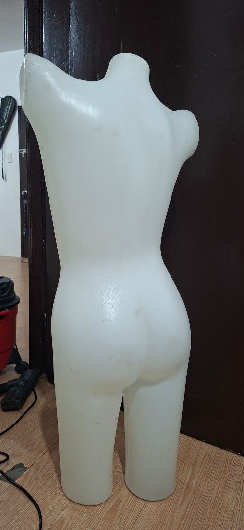 Female Torso Mannequin Display Form (Category: Blouses) located in Manila. Submitted by princessahshop (Listing ID 1468844711, Image 3). Description: - White plastic female torso mannequin with partial legs - Hollow back design making it lightweight and easy to hang or move - Perfect for displaying tops, dresses, and bottoms - Sturdy material that stands or lays flat easily - Note: Shows minor smudges and scuffs from storage.
