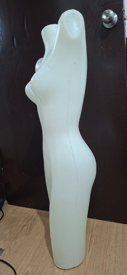 Female Torso Mannequin Display Form (Category: Blouses) located in Manila. Submitted by princessahshop (Listing ID 1468844711, Image 2). Description: - White plastic female torso mannequin with partial legs - Hollow back design making it lightweight and easy to hang or move - Perfect for displaying tops, dresses, and bottoms - Sturdy material that stands or lays flat easily - Note: Shows minor smudges and scuffs from storage.