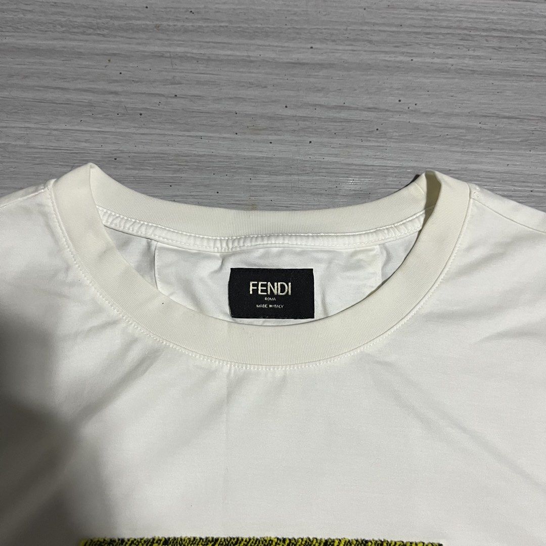 FENDI YELLOW BOX LOGO GRAPHIC (Category: Tshirts & Polo Shirts ) located in Iloilo. Submitted by thrift2cali (Listing ID 1468720050, Image 2). Description: ITEM NAME: F ÊND I DIMES: 20 / 26 SIZE: MEDIUM CONDITION: LIKE NEW ISSUE: NONE COLOR MAY VARY DUE TO LIGHTING - ADD SF OUTSIDE ILL CITY!.