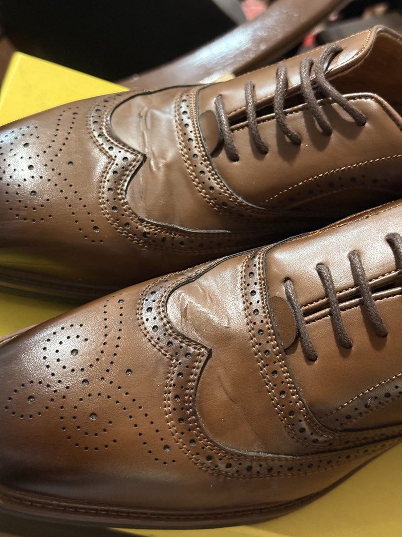 Figlia Uomo Gustavo Brown Brogues Size 42 (Category: Dress Shoes) located in Calamba. Submitted by itszygie (Listing ID 1468734892, Image 3). Description: - Brand/Model: Figlia Uomo Gustavo - Size: 42 - Color: Rich brown with burnished toe finish - Design: Classic brogue wingtip with lace-up front - Inclusions: Original yellow and black box from The SM Store - Condition: Great for formal wear, office attire, weddings, and special events - Only we