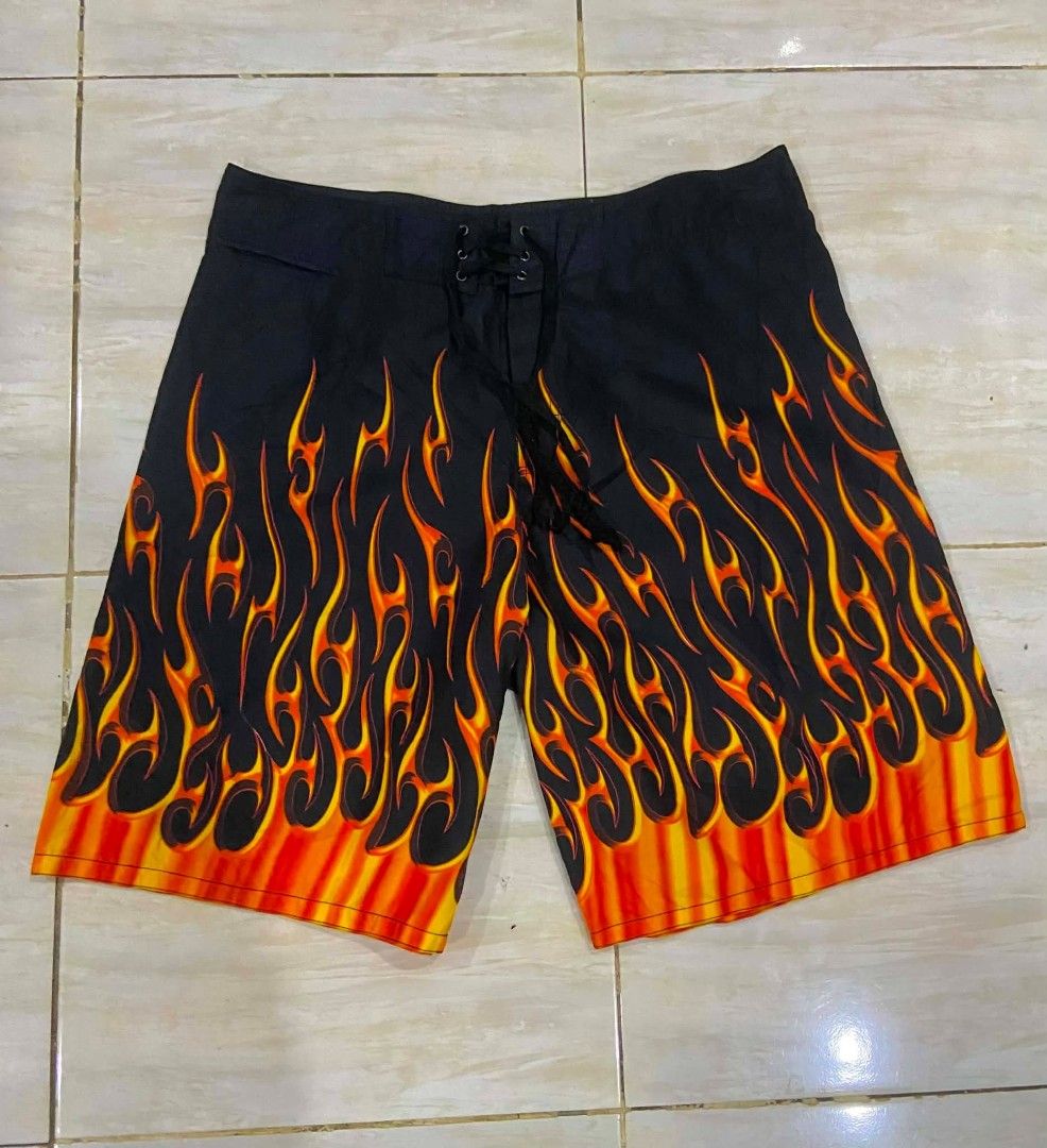 Flame Short (Category: Swim Trunks & Board Shorts) located in Manila. Submitted by vicious1419 (Listing ID 1468833316, Image 1). Description: Boardshort flame Size 36 Length 22 Good as new QC📍 Borgata Collection flame boardshorts. Black base with vibrant orange and yellow flame print rising from the hems. Classic lace-up front closure with black eyelets and black braided drawstrings. Inside yellow brand tag reads Borgata Collection Est. 2003. Gr