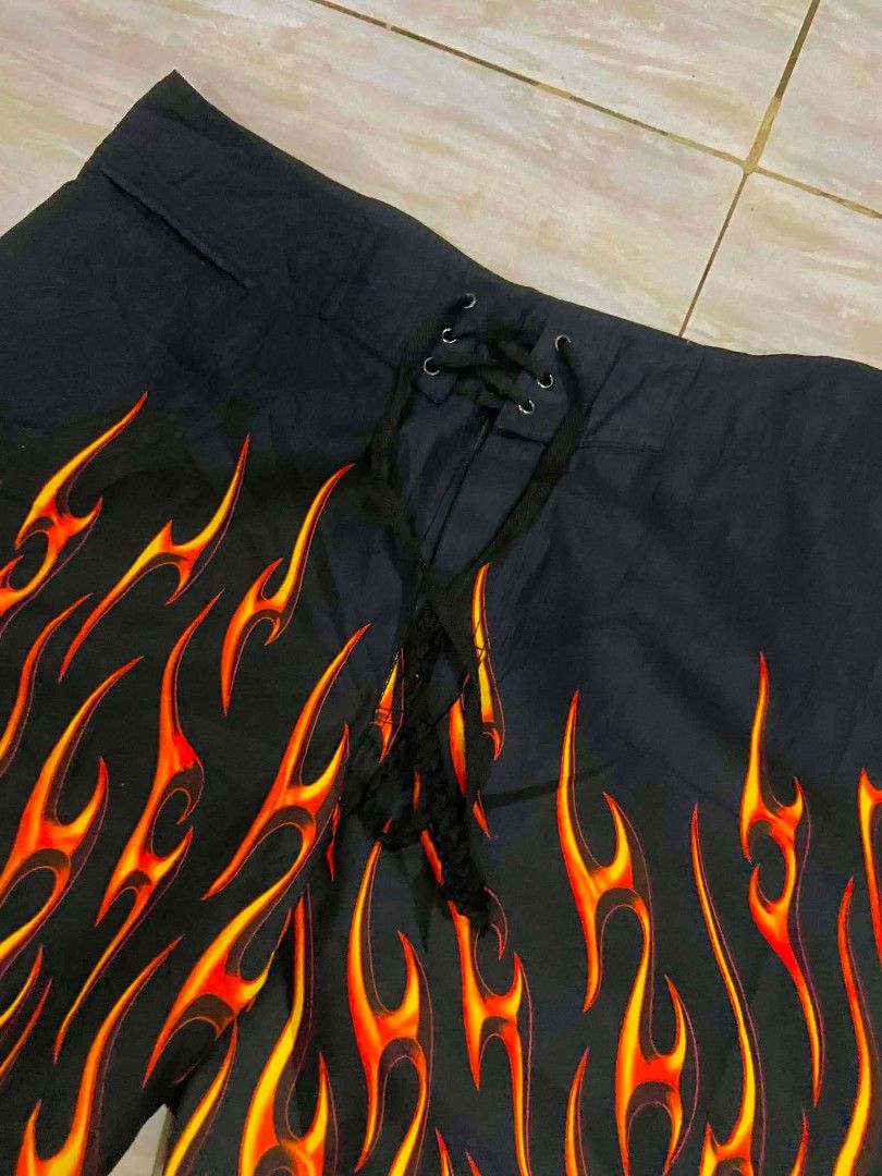 Flame Short (Category: Swim Trunks & Board Shorts) located in Manila. Submitted by vicious1419 (Listing ID 1468833316, Image 2). Description: Boardshort flame Size 36 Length 22 Good as new QC📍 Borgata Collection flame boardshorts. Black base with vibrant orange and yellow flame print rising from the hems. Classic lace-up front closure with black eyelets and black braided drawstrings. Inside yellow brand tag reads Borgata Collection Est. 2003. Gr