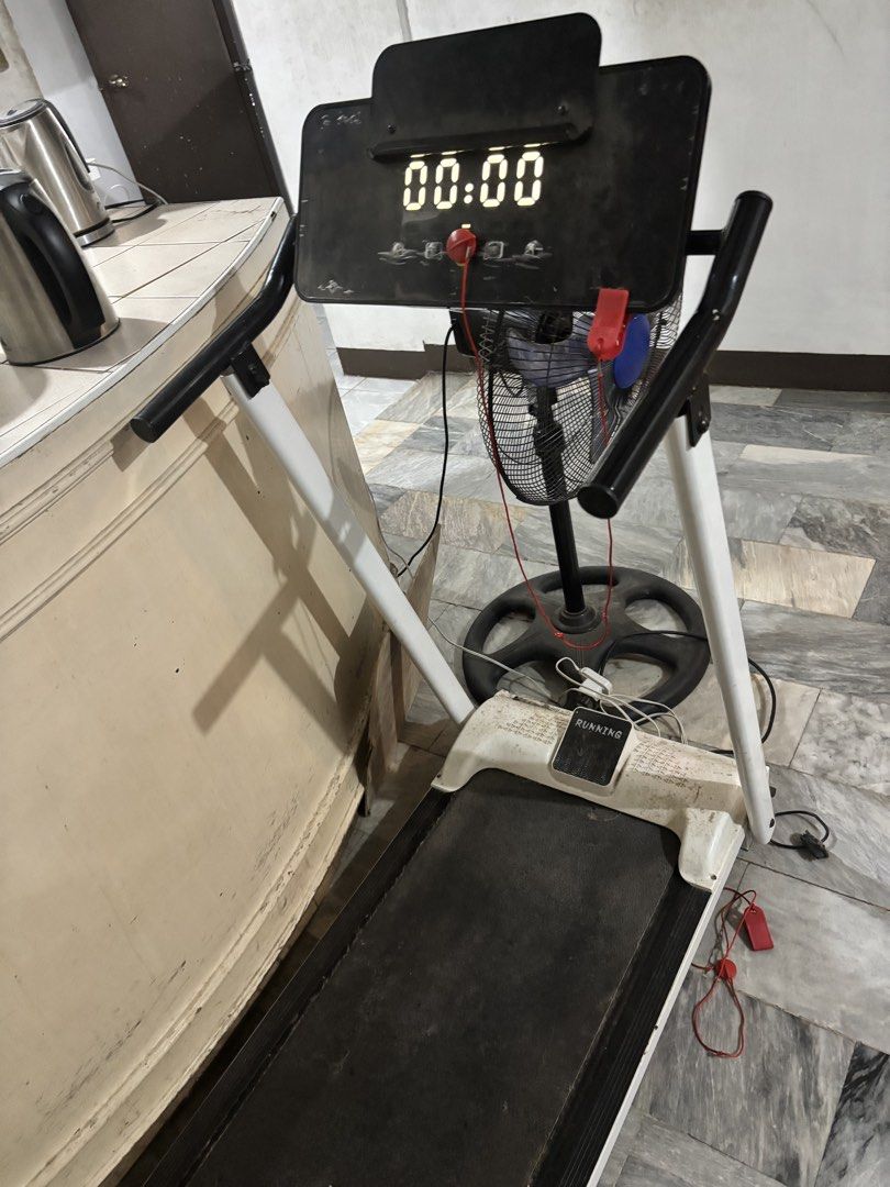 Foldable Electric Treadmill with Digital Display (Category: Cardio & Fitness Machines) located in Manila. Submitted by infinitetsukoyomi (Listing ID 1468718951, Image 1). Description: - Color: Black and white design - Display: Digital screen with clear time tracking - Safety: Includes safety key with red cord - Perfect for home workouts! NO ISSUES Speed: up to 10 no incline Modes: speed, distance, time, calories Works well, just needed cleaning B
