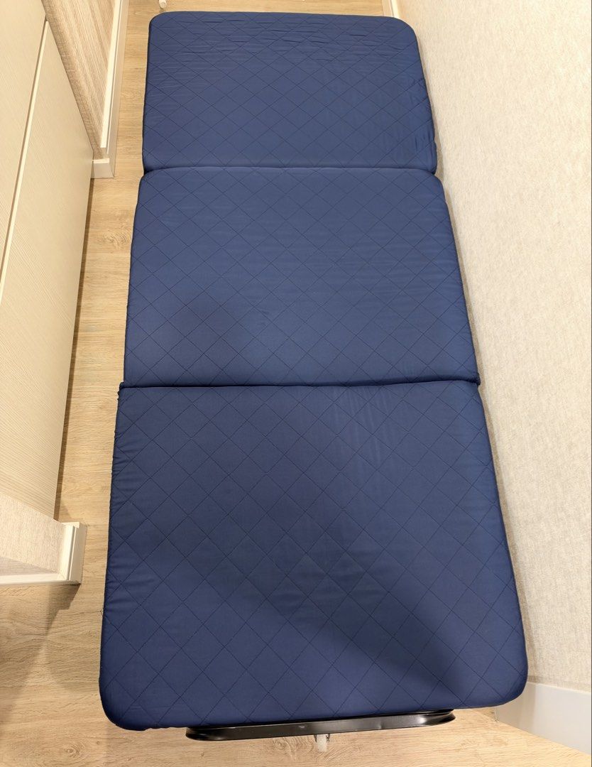 Foldable Single Guest Bed with Mattress and Wheels (Category: Bed Frames & Mattresses) located in Manila. Submitted by lorymingui15824 (Listing ID 1468808971, Image 1). Description: - Color: Navy blue mattress with a sleek black metal frame - Compact & Foldable: Easily folds up for space-saving storage - Portable: Equipped with wheels at the base for effortless moving - Durable: Sturdy build designed for everyday reliability - Ideal Use: Great ex