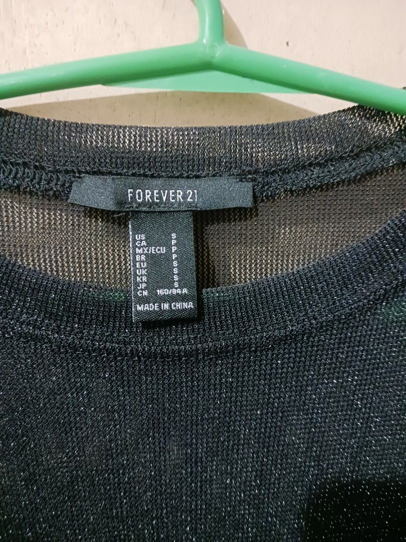 Forever 21 Black Glittery Long Sleeve Mesh Top (Category: Longsleeves) located in Quezon City. Submitted by kaye.dy1 (Listing ID 1468785679, Image 3). Description: - Brand: Forever 21 - Size: Small - Color: Black with sparkly glitter woven all over - Material: Sheer mesh fabric - Fit: Fitted cut with a classic round neckline - Style: Great layering piece for nights out, parties, and clubbing - Condition: Excellent -Length: 33.5".