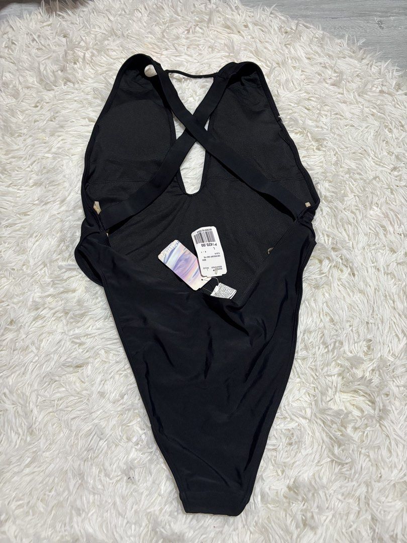 Forever 21 Black One Piece Swimsuit (Category: Bikinis & Swimsuits) located in Quezon City. Submitted by lovedbysloane (Listing ID 1468721090, Image 2). Description: - Brand: Forever 21 - Item: One-piece swimsuit - Color: Black - Size: L - Design: Plunging neckline with criss-cross back straps - Material: Nylon/Polyamide & Spandex/Elastane - Condition: Brand new with original tags attached, never worn - Environment: Clean, smoke-free home.