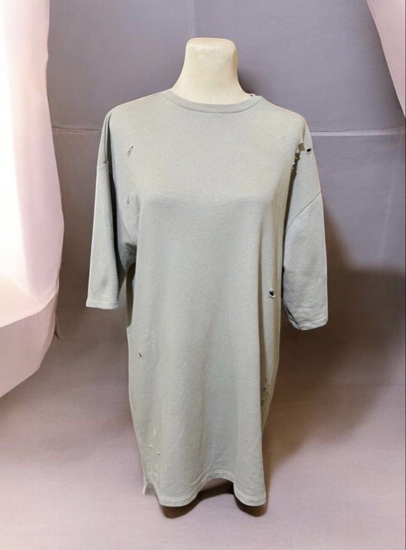 Forever 21 Distressed Grey Oversized T-Shirt (Category: Tshirts & Polo Shirts ) located in Quezon City. Submitted by letsdeclutter101 (Listing ID 1468801733, Image 3). Description: - Brand: Forever 21 - Color: Grey - Fit: Relaxed oversized streetwear fit - Details: Distressed with holes and rips all over the front and back - Neckline: Crew neck - Sleeves: Elbow-length half sleeves.