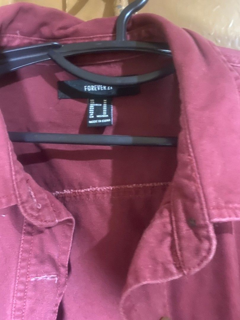 Forever 21 Maroon Long Sleeve Button Up Jacket (Category: Coats, Jackets and Outerwear) located in Muntinlupa City. Submitted by swiftowl.0cc8ab (Listing ID 1468855472, Image 2). Description: - Brand: Forever 21 - Color: Maroon - Size: Medium - Style: Long sleeve button-up jacket with classic collar - Details: Two front chest pockets with button closures and trendy raw frayed hem - Origin: Made in China - Condition: Excellent.